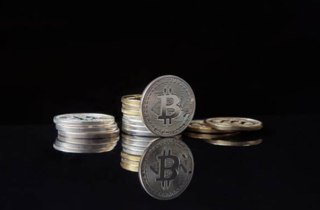 Silver crypto coins on dark surface